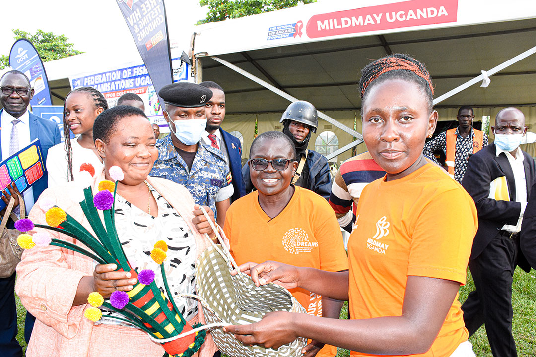 Rt. Hon. Robinah Nabbanja, Prime Minister of Uganda receives some of the materials produced by the Adolescent and Young Women during the DREAMS program.