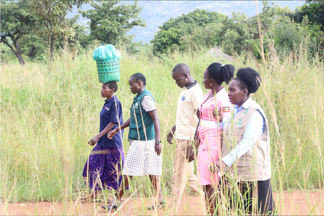 Vincent Okwera Lapi leads The TOGETHER project team and a health worker on a household visit to the local community.